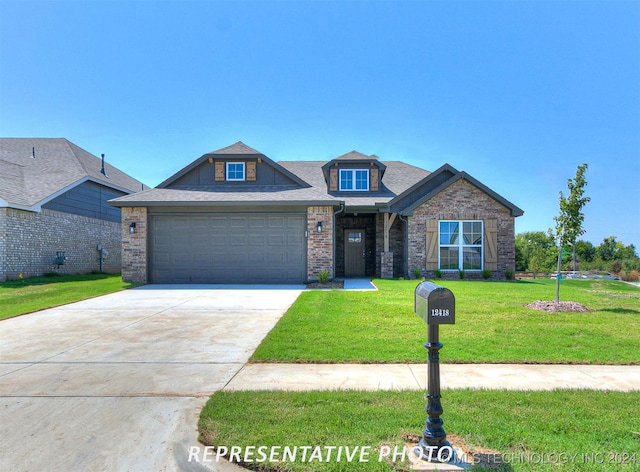 craftsman-style house featuring a garage and a front lawn