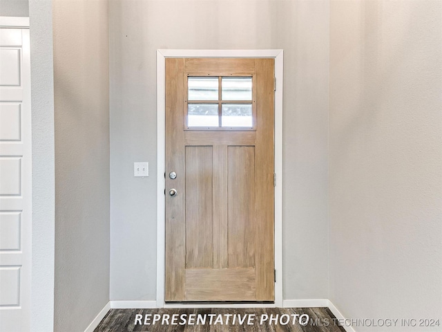 entryway with dark wood-type flooring