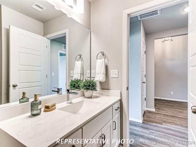 bathroom featuring vanity and hardwood / wood-style flooring