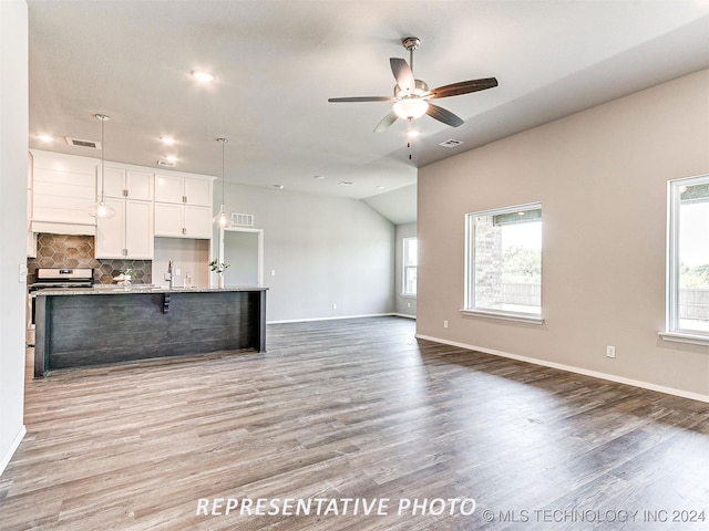 kitchen with ceiling fan, hardwood / wood-style flooring, and white cabinetry