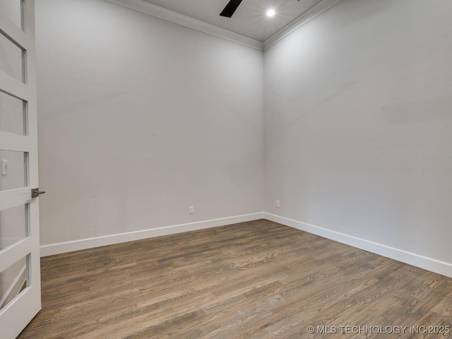 unfurnished room featuring ornamental molding, ceiling fan, and dark hardwood / wood-style flooring