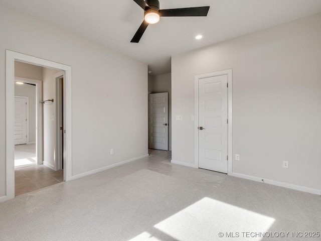 unfurnished bedroom featuring ceiling fan