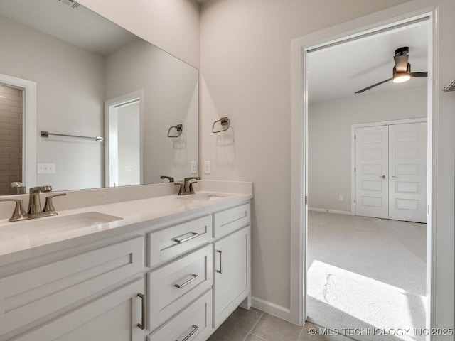 bathroom with ceiling fan, vanity, and tile patterned flooring