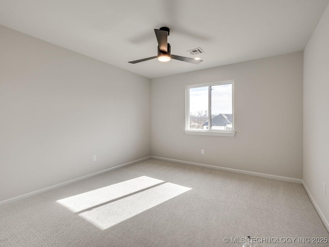 spare room with ceiling fan and carpet floors