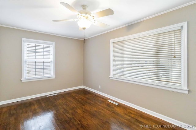 spare room with ornamental molding, dark hardwood / wood-style flooring, and ceiling fan