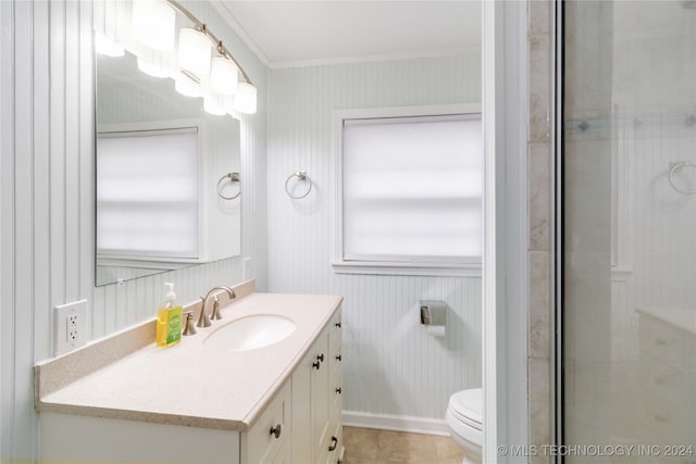 bathroom with vanity, toilet, and ornamental molding