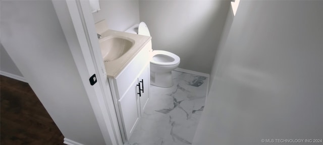 bathroom with vanity and toilet