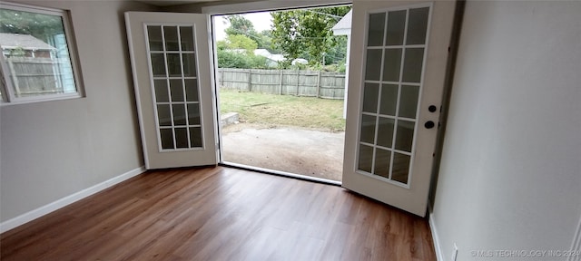 doorway to outside featuring hardwood / wood-style flooring