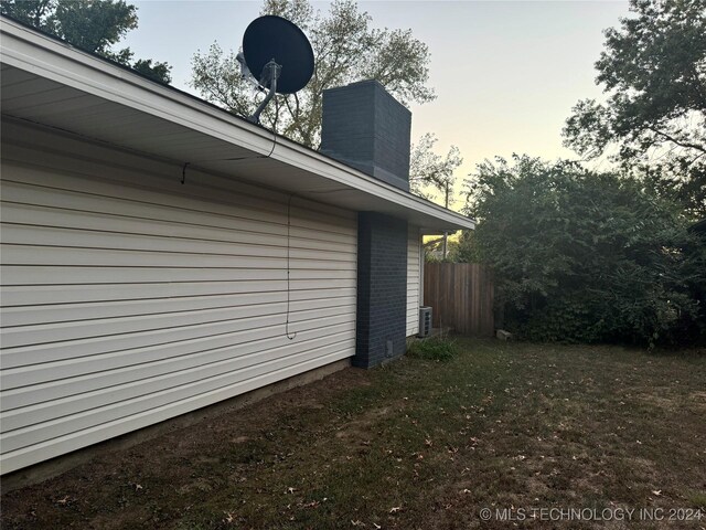1335 N Mcfarland Pl, Claremore, OK 74017 - view of property exterior featuring a chimney and brick siding