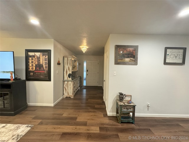 hallway featuring dark hardwood / wood-style flooring