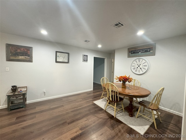 dining area with dark hardwood / wood-style floors