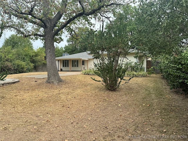1335 N Mcfarland Pl, Claremore, OK 74017 - view of front of home with a chimney