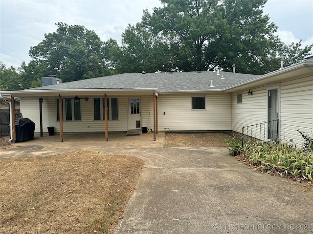 1335 N Mcfarland Pl, Claremore, OK 74017 - rear view of property featuring a patio and a chimney
