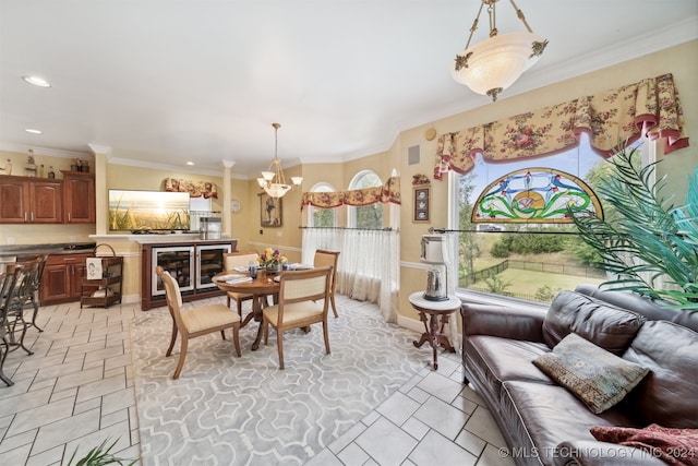 dining room with an inviting chandelier and ornamental molding