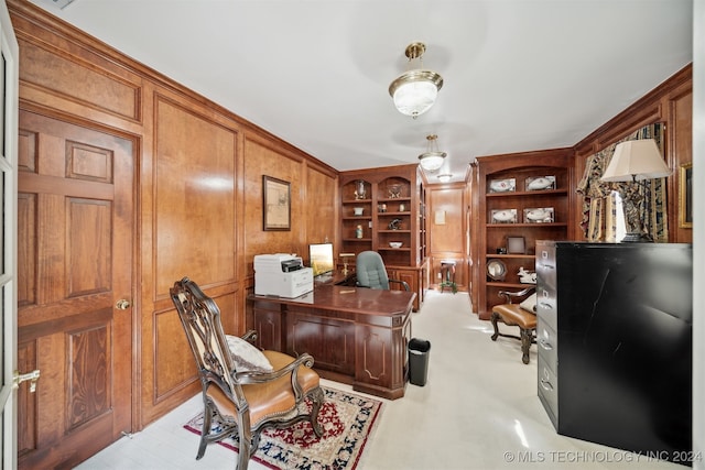 office space with light colored carpet and built in features