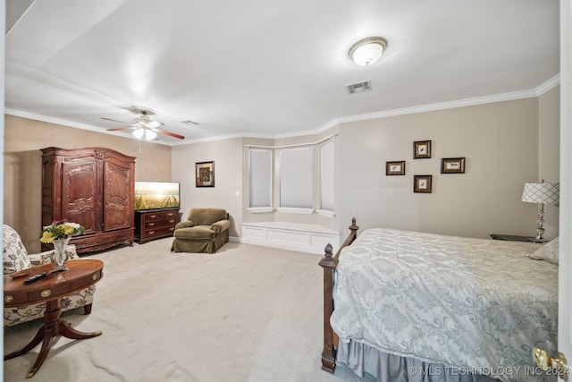 carpeted bedroom with crown molding and ceiling fan