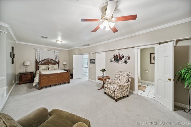 carpeted bedroom featuring ceiling fan and ornamental molding