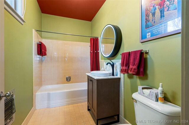 full bathroom featuring vanity, shower / tub combo, and toilet