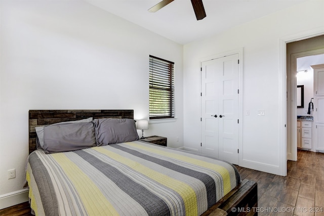 bedroom with dark hardwood / wood-style floors and ceiling fan