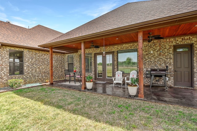 exterior space with grilling area and ceiling fan