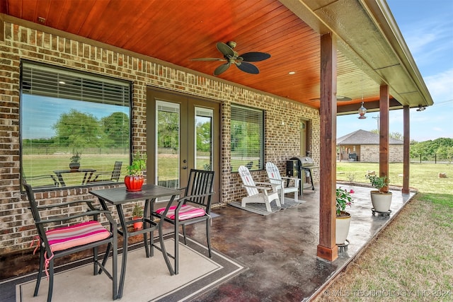 view of patio with grilling area and ceiling fan