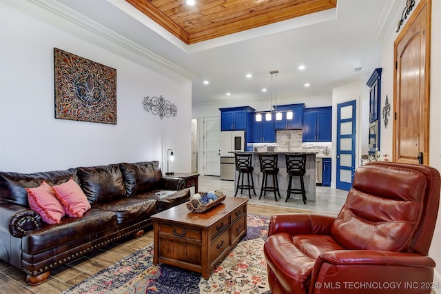 living room with crown molding, wood ceiling, a raised ceiling, and dark wood-type flooring