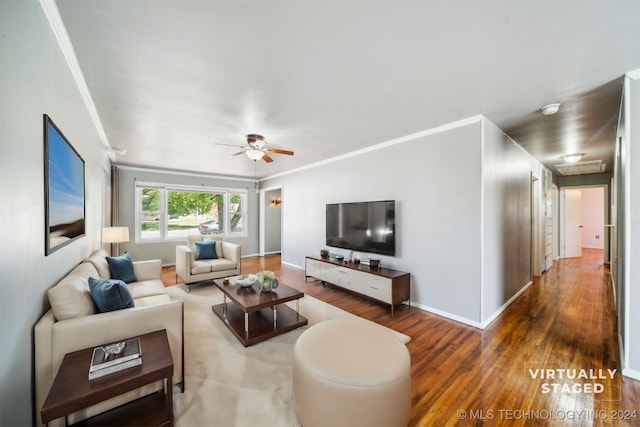 living room with ceiling fan, hardwood / wood-style flooring, and crown molding