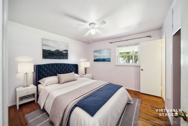 bedroom featuring dark wood-type flooring and ceiling fan