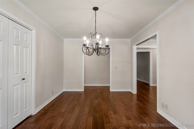 unfurnished dining area featuring ornamental molding, an inviting chandelier, and dark hardwood / wood-style flooring