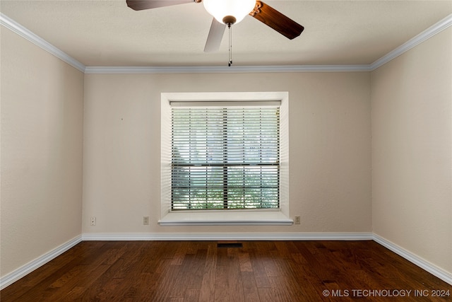 spare room featuring crown molding, dark wood-type flooring, and ceiling fan