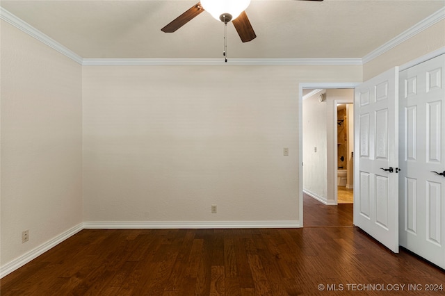 spare room featuring ornamental molding, ceiling fan, and dark hardwood / wood-style floors