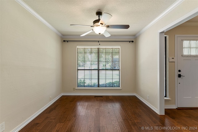 entryway with a textured ceiling, dark wood-type flooring, ceiling fan, and ornamental molding