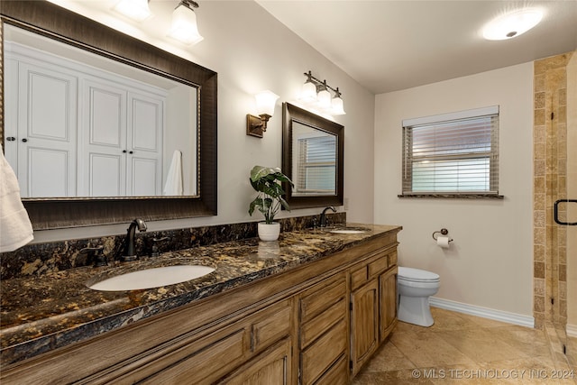 bathroom with an enclosed shower, toilet, and vanity