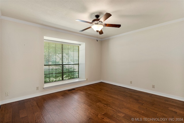 spare room featuring ornamental molding, dark wood-type flooring, and ceiling fan