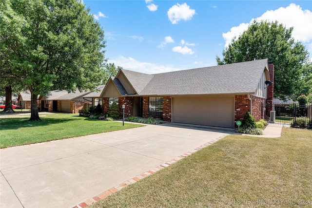 ranch-style home featuring a garage and a front yard