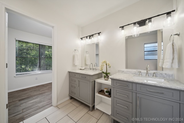 bathroom with vanity and hardwood / wood-style flooring