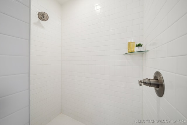 bathroom with a tile shower