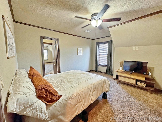 bedroom with crown molding, a textured ceiling, ceiling fan, carpet, and lofted ceiling