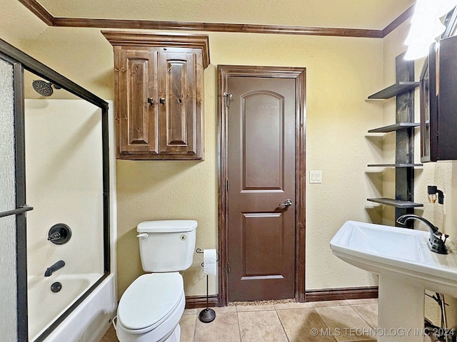 bathroom with tile patterned flooring, toilet, and bath / shower combo with glass door