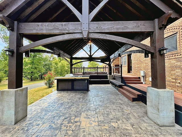 view of patio / terrace featuring an outdoor kitchen and a gazebo