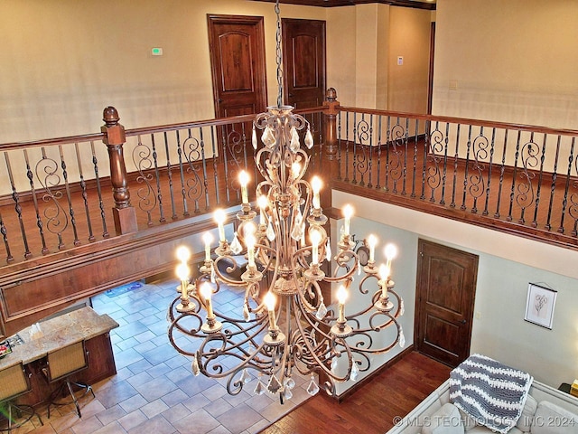 interior space featuring hardwood / wood-style flooring and a notable chandelier