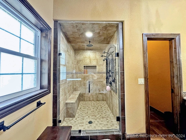 bathroom with a shower with shower door