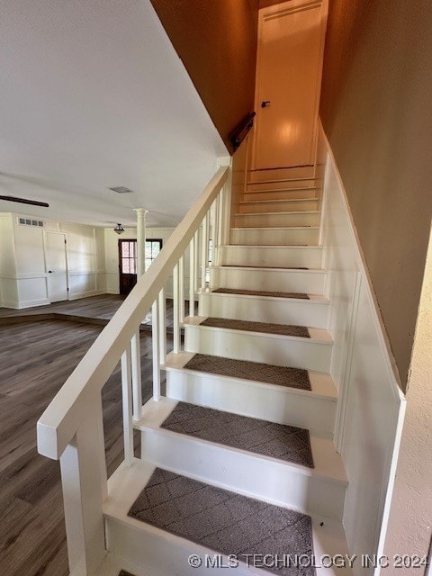 staircase featuring hardwood / wood-style flooring