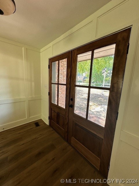 doorway to outside featuring dark wood-type flooring and french doors