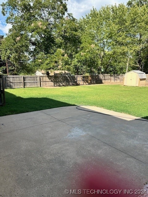 view of patio with a shed