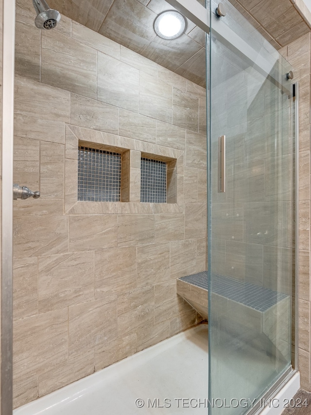 bathroom with an enclosed shower