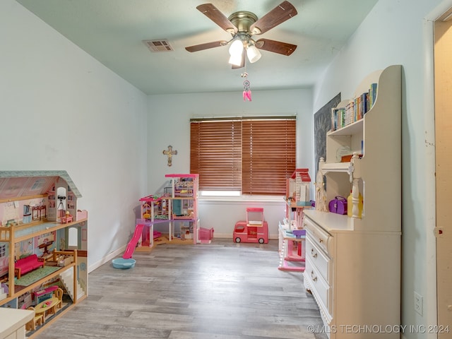 rec room with hardwood / wood-style flooring and ceiling fan