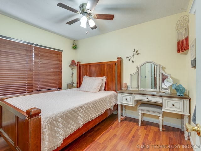 bedroom featuring hardwood / wood-style flooring and ceiling fan