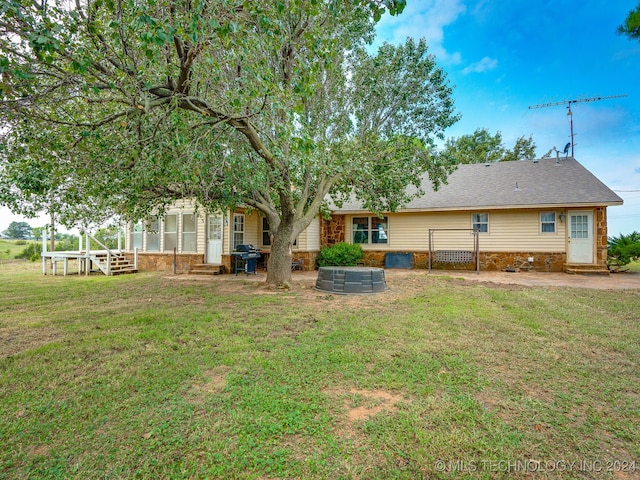 rear view of house with a lawn