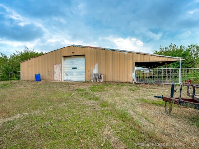 view of outbuilding with a garage